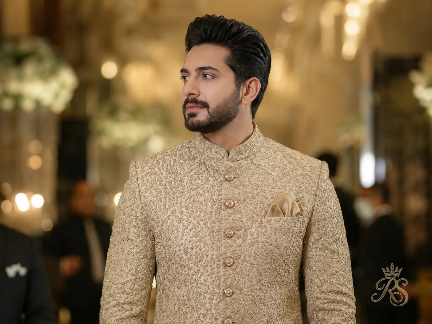 Groom in a richly embroidered bandhgala sherwani with a structured collar and refined finish